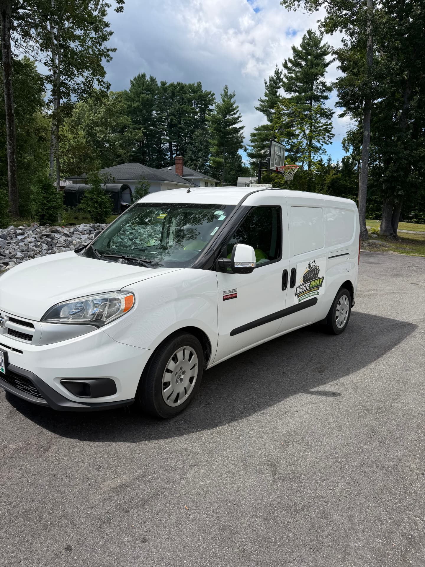 Waste Away work van parked at a Southern Maine job site