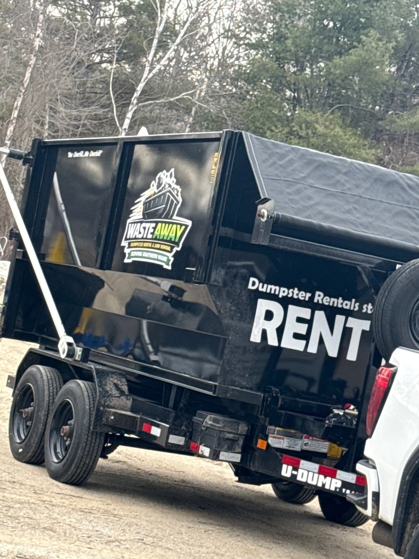 Waste Away dumpster trailer hooked up and ready to haul